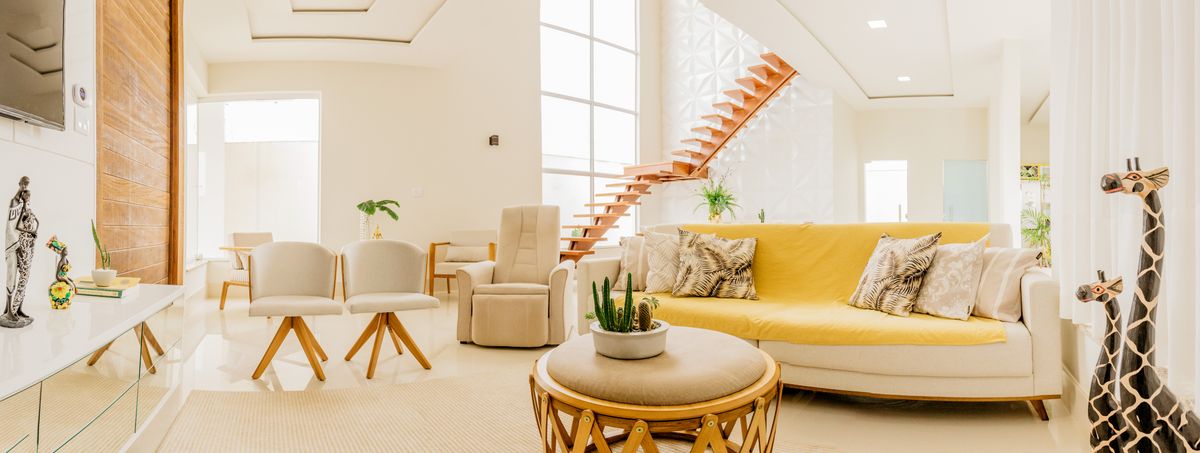 A bright, freshly cleaned open living room with natural light
